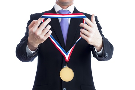 14230315-cropped-torso-of-man-wearing-black-suit-and-awarding-blank-sports-gold-medal.jpg