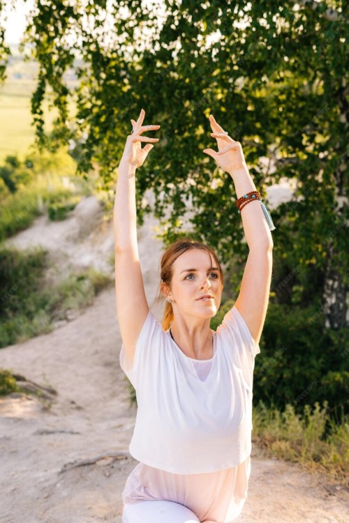 portrait-young-woman-doing-warrior-yoga-asana-pose-top-rock-background-landscape_482921-8093ea1f7975a3aa6423.jpg